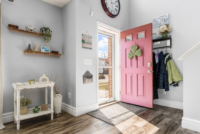 entryway with wood finished floors and baseboards