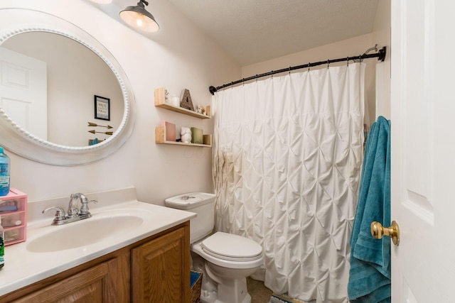 bathroom with a shower with curtain, toilet, vanity, and a textured ceiling