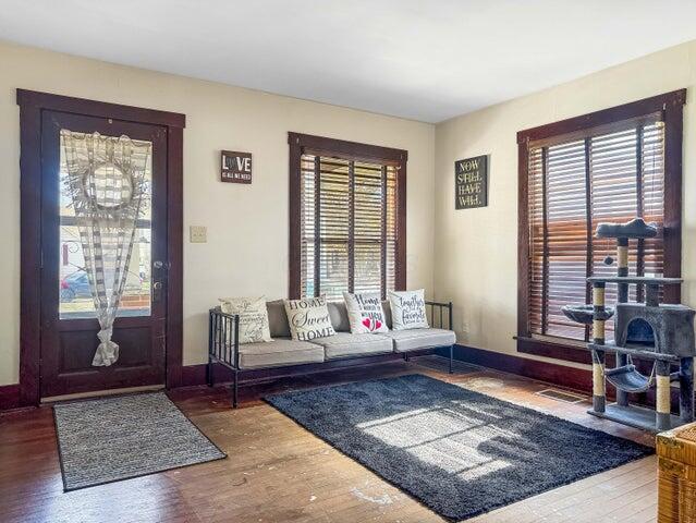 812 S Main St, Urbana, OH 43078 - entryway with visible vents, baseboards, and wood finished floors