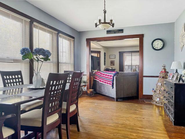 812 S Main St, Urbana, OH 43078 - dining room with an inviting chandelier and wood finished floors