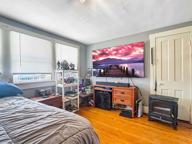 812 S Main St, Urbana, OH 43078 - bedroom with multiple windows and wood finished floors