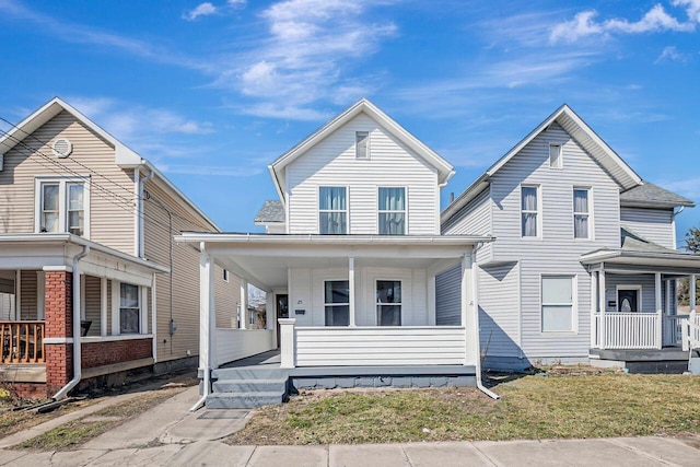 traditional-style home featuring covered porch