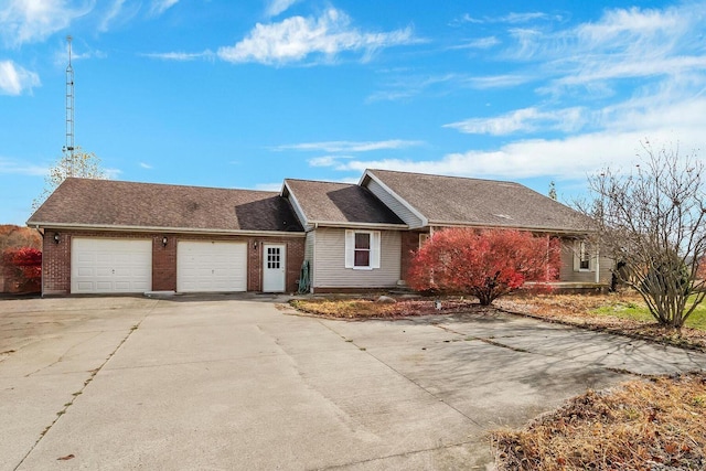 ranch-style home featuring brick siding, roof with shingles, concrete driveway, and an attached garage
