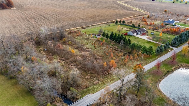 drone / aerial view featuring a rural view and a water view
