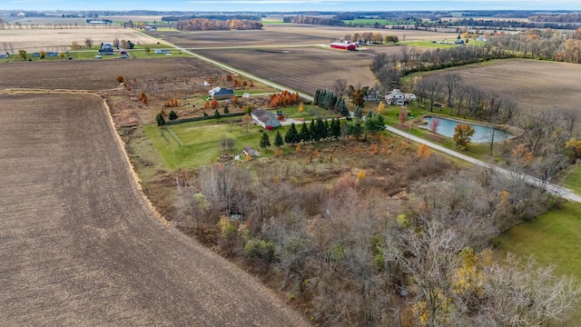 drone / aerial view featuring a rural view and a water view
