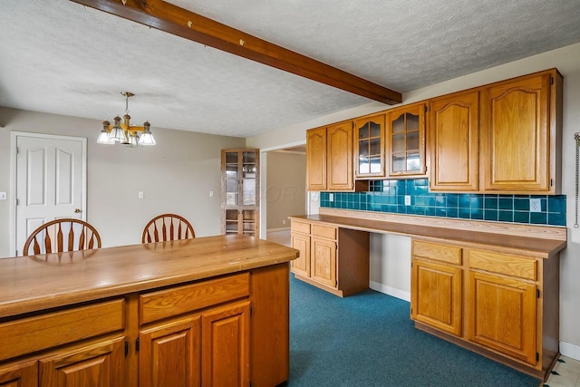 kitchen with wooden counters, glass insert cabinets, decorative backsplash, brown cabinets, and an inviting chandelier