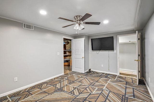 interior space with crown molding, recessed lighting, baseboards, and visible vents