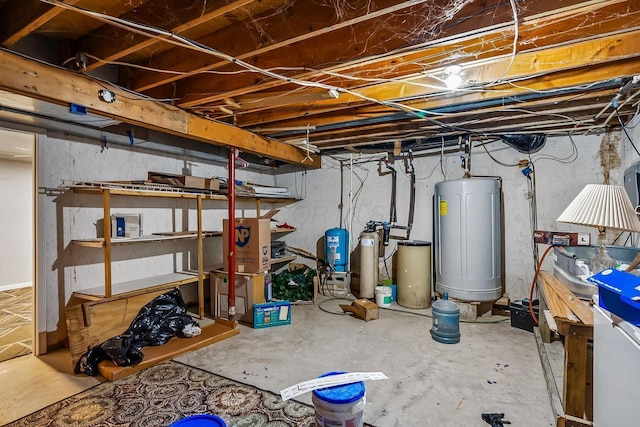 unfinished basement featuring water heater