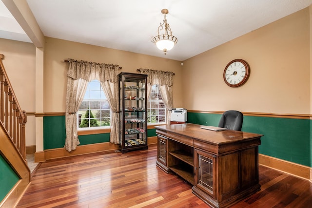 office featuring hardwood / wood-style flooring and baseboards