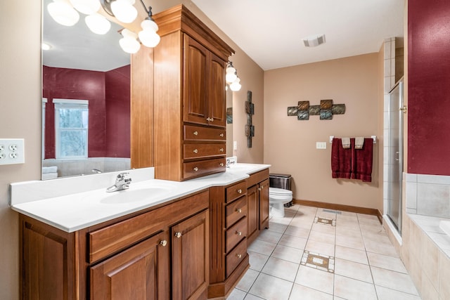 full bathroom featuring visible vents, toilet, a sink, a shower stall, and double vanity