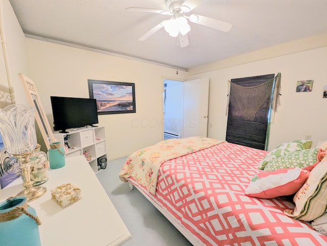 bedroom with ceiling fan and a baseboard radiator