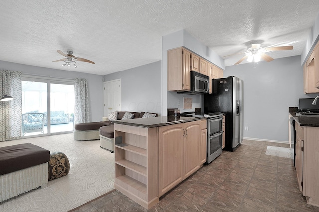 kitchen with open shelves, a ceiling fan, open floor plan, and appliances with stainless steel finishes