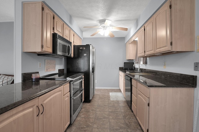 kitchen with double oven range, ceiling fan, light brown cabinetry, a sink, and dishwasher