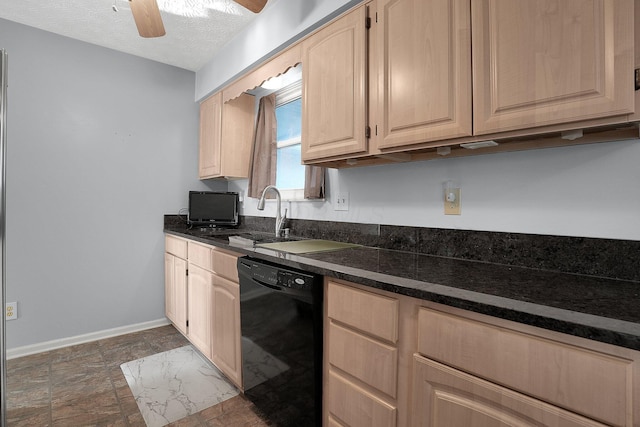 kitchen with baseboards, ceiling fan, a sink, light brown cabinetry, and black dishwasher