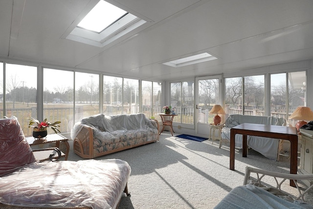 sunroom with a wealth of natural light and a skylight