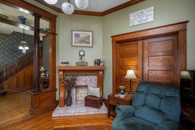 sitting room featuring crown molding and parquet flooring