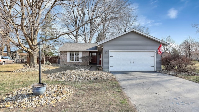 single story home with fence, brick siding, a garage, and driveway