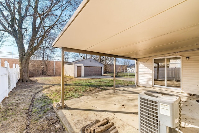 view of patio featuring an outbuilding, central AC unit, and fence