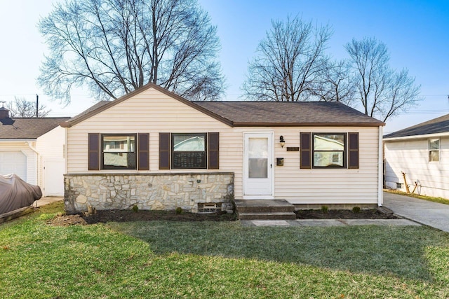 view of front of property with stone siding and a front lawn