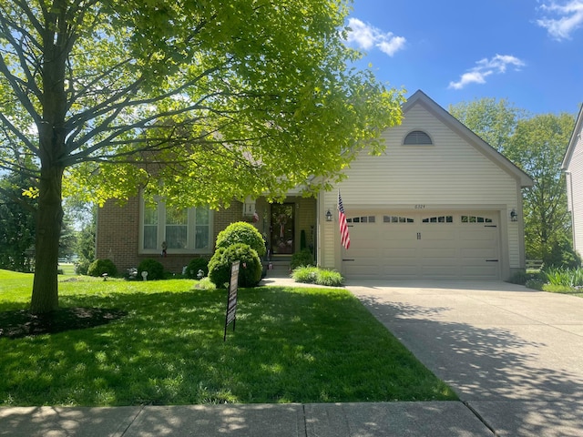 6324 Rossmore Ln, Canal Winchester, OH 43110 - obstructed view of property with a garage, brick siding, a front yard, and concrete driveway