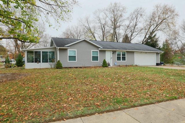 ranch-style house with a front lawn, a garage, and a sunroom