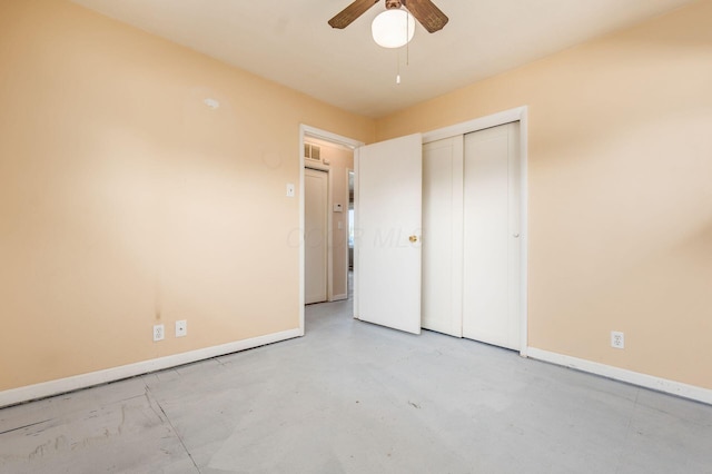 unfurnished bedroom featuring a closet, visible vents, concrete floors, and baseboards