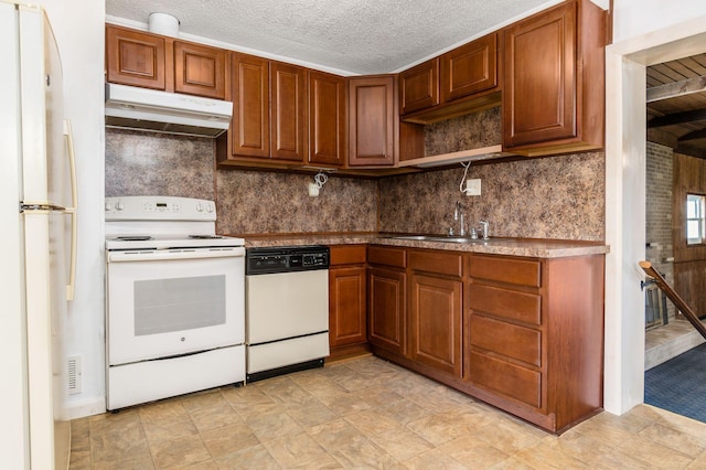 kitchen with under cabinet range hood, decorative backsplash, white appliances, and a sink