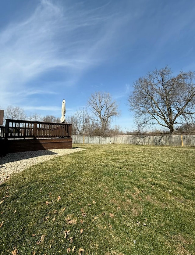 view of yard featuring a wooden deck