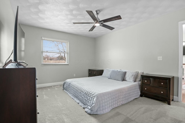 bedroom with baseboards, carpet, and ceiling fan