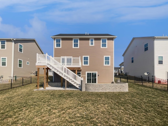 back of property featuring a patio, a lawn, a deck, and stairs