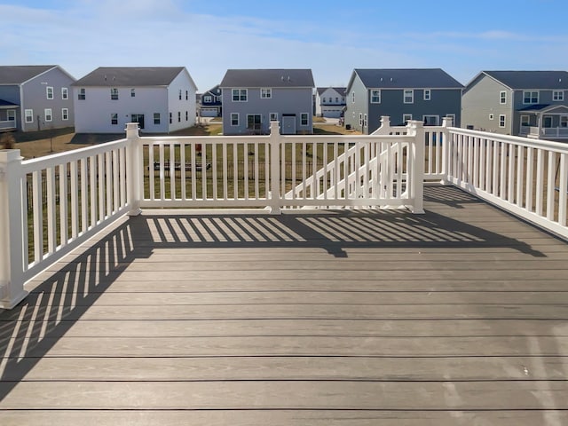 wooden terrace featuring a residential view