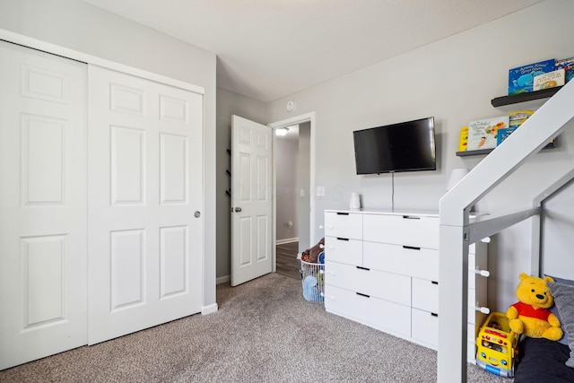 bedroom with a closet and carpet flooring