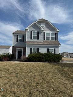 view of front facade with a front yard