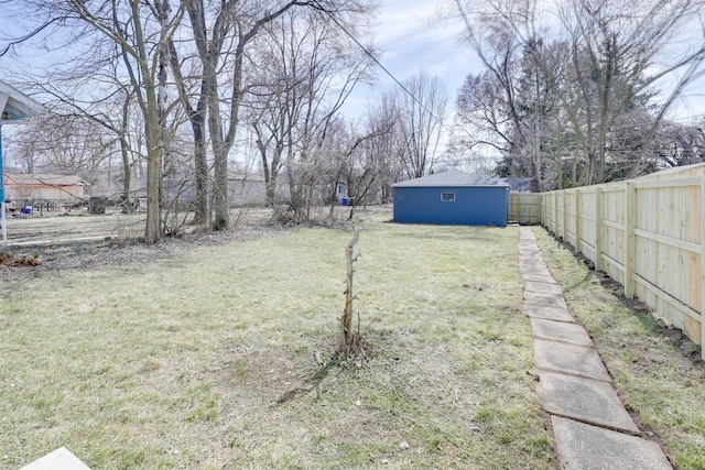 view of yard featuring an outdoor structure and fence