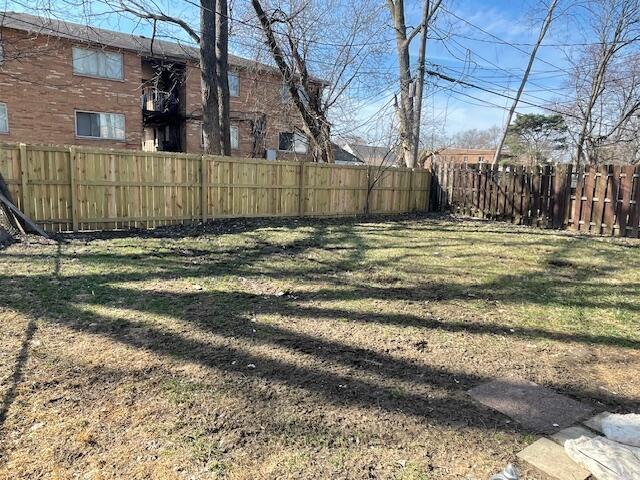 view of yard with a fenced backyard