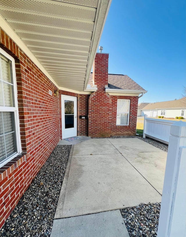 view of patio featuring fence