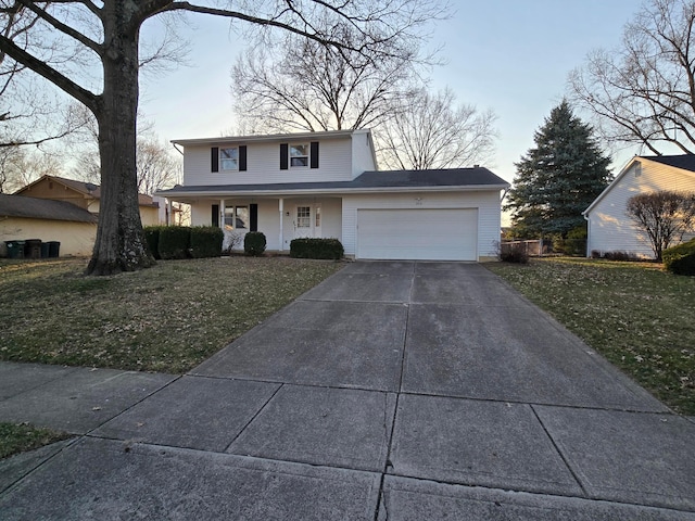 traditional-style house with a garage, a porch, concrete driveway, and a front yard