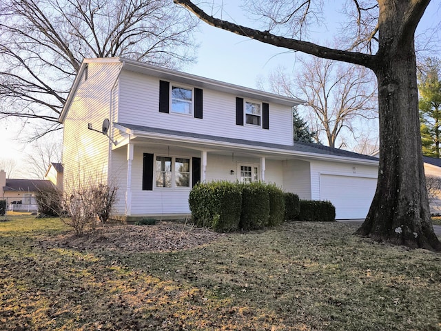 traditional home with a porch and an attached garage