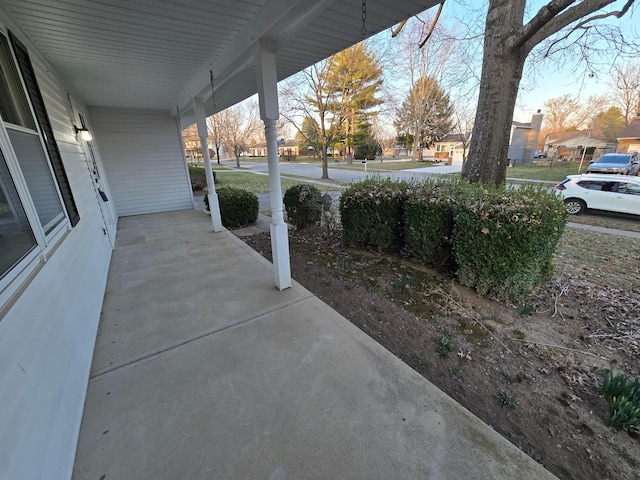 view of patio / terrace featuring covered porch and a residential view