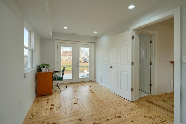 interior space featuring recessed lighting, french doors, and hardwood / wood-style floors