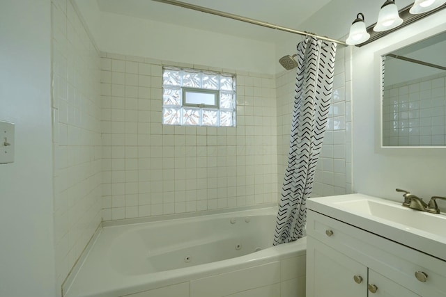 bathroom with vanity and a combined bath / shower with jetted tub