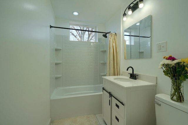 bathroom with shower / bath combination with curtain, toilet, and vanity