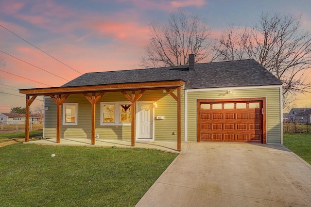 view of front of home with a garage, a front lawn, a porch, and driveway