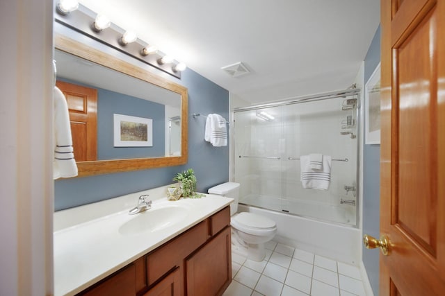 bathroom featuring vanity, visible vents, enclosed tub / shower combo, tile patterned floors, and toilet