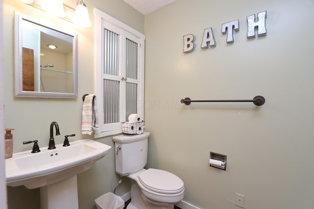 bathroom with a sink and toilet