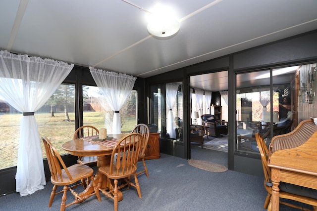 dining area featuring carpet