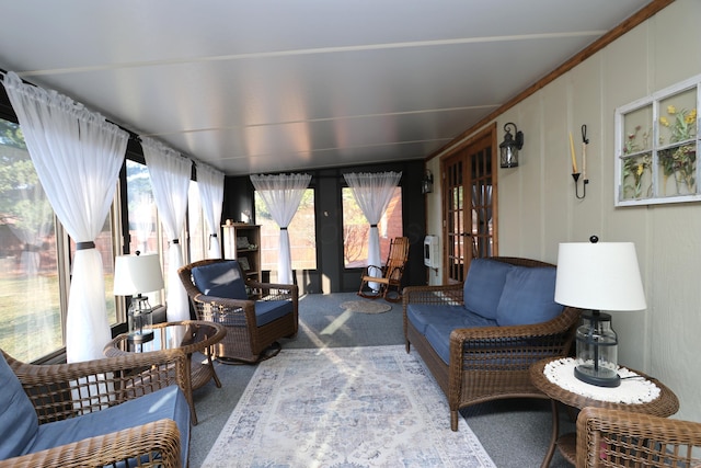 living room featuring french doors and carpet