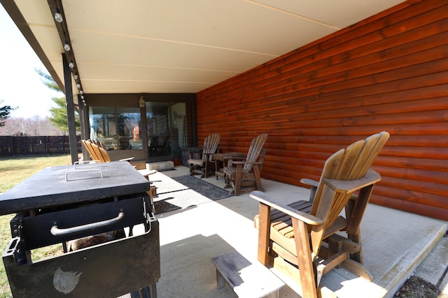 view of patio featuring fence