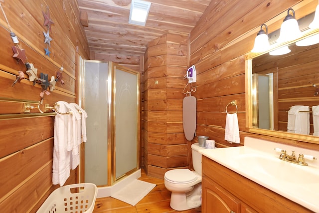 full bath with toilet, a stall shower, wooden ceiling, wood walls, and vanity