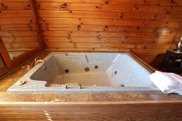 bathroom with wood walls